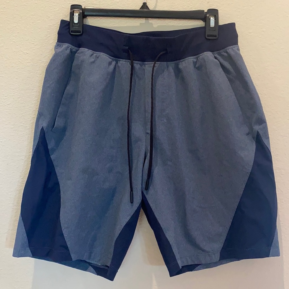 Lululemon Men’s size medium blue with navy blue  lined short